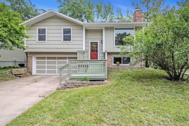 2149 Fair St, Ann Arbor, MI 48103 - split foyer home with brick siding, a chimney, driveway, an attached garage, and a front lawn