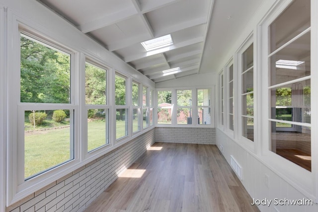 6449 Wendell St SE, Grand Rapids, MI 49546 - unfurnished sunroom with wood finished floors and a skylight