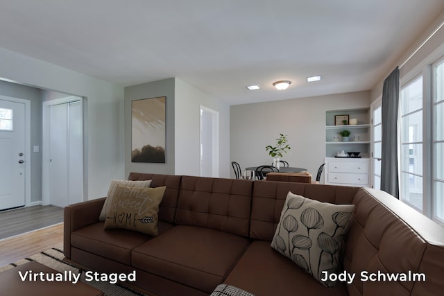 6449 Wendell St SE, Grand Rapids, MI 49546 - living area featuring plenty of natural light and wood finished floors