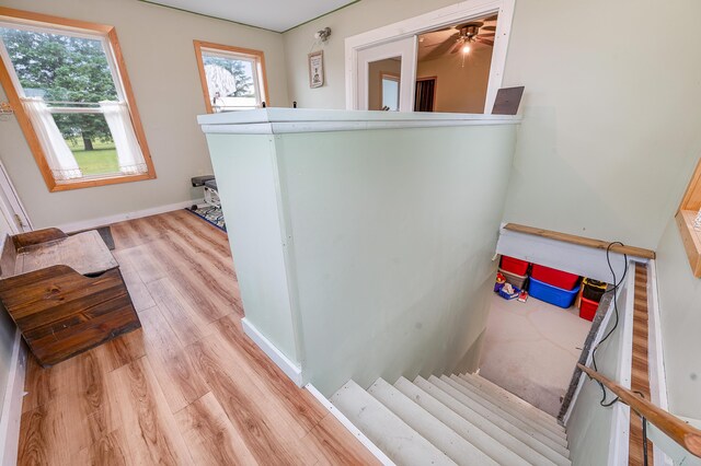 20550 19 Mile Rd, Big Rapids, MI 49307 - stairway featuring wood finished floors, baseboards, and ceiling fan
