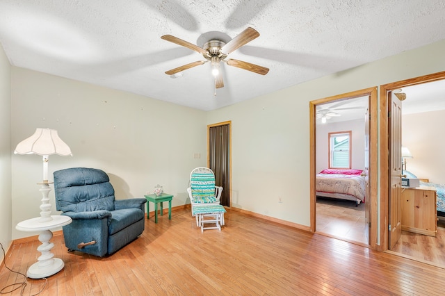 20550 19 Mile Rd, Big Rapids, MI 49307 - sitting room with a ceiling fan, hardwood / wood-style floors, a textured ceiling, and baseboards