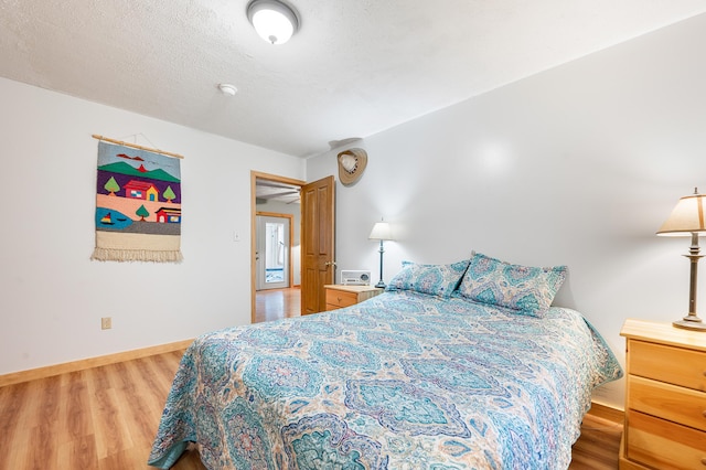 20550 19 Mile Rd, Big Rapids, MI 49307 - bedroom featuring light wood-type flooring and baseboards