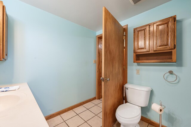 20550 19 Mile Rd, Big Rapids, MI 49307 - bathroom featuring toilet, vanity, baseboards, and tile patterned floors