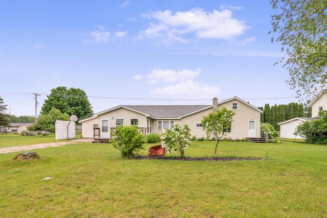 20550 19 Mile Rd, Big Rapids, MI 49307 - ranch-style home with a front yard, driveway, and a chimney