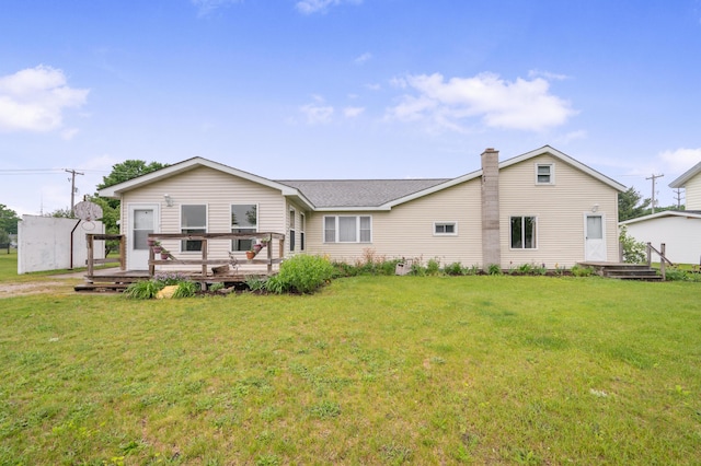 20550 19 Mile Rd, Big Rapids, MI 49307 - rear view of property with a yard, a wooden deck, a chimney, and roof with shingles