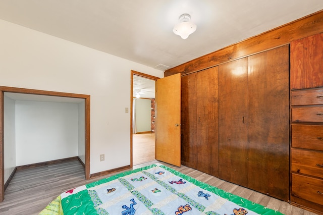 20550 19 Mile Rd, Big Rapids, MI 49307 - bedroom with light wood-style flooring, a closet, and baseboards