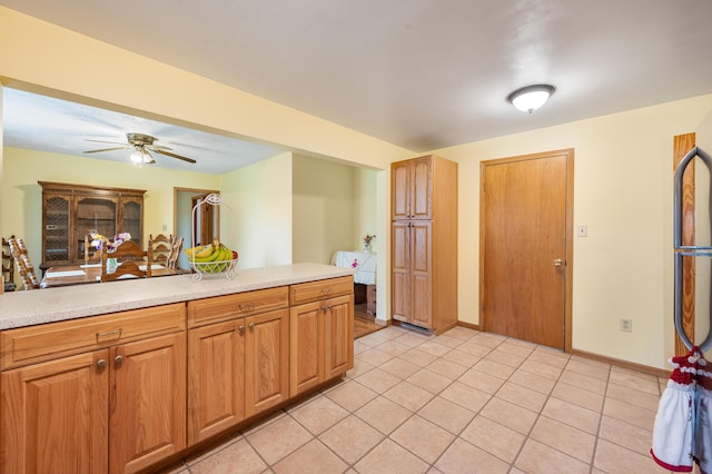 20550 19 Mile Rd, Big Rapids, MI 49307 - kitchen featuring light countertops, ceiling fan, and light tile patterned flooring