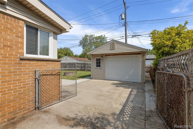 5115 Arden Ave, Warren, MI 48092 - detached garage with concrete driveway and a gate