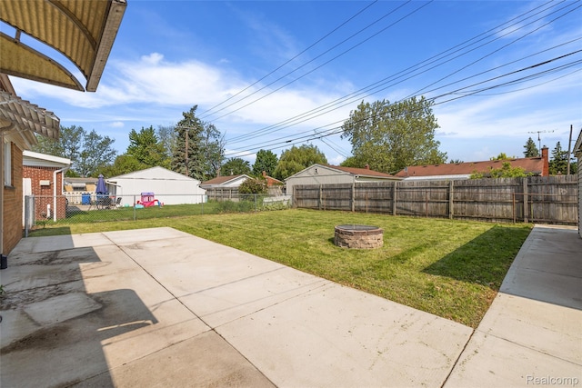 5115 Arden Ave, Warren, MI 48092 - view of yard featuring an outdoor fire pit and a patio