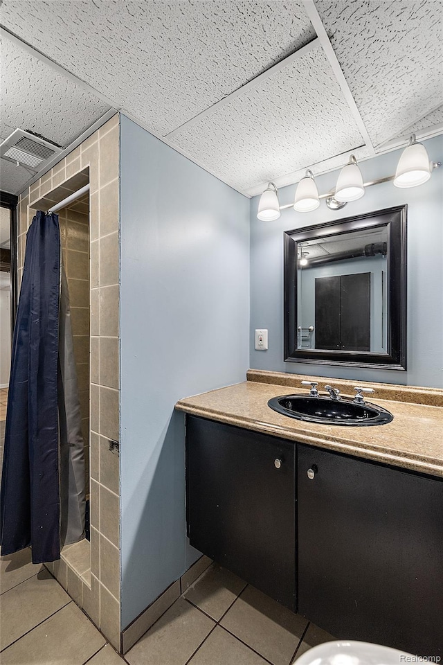 5115 Arden Ave, Warren, MI 48092 - bathroom featuring tile patterned flooring, vanity, and a tile shower