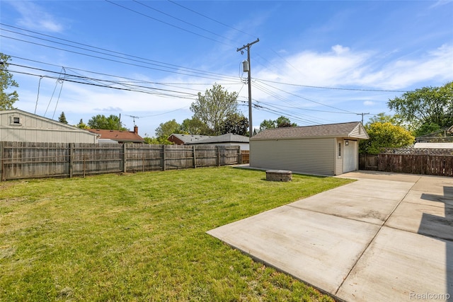 5115 Arden Ave, Warren, MI 48092 - view of yard with a patio area, an outdoor fire pit, a detached garage, and an outdoor structure