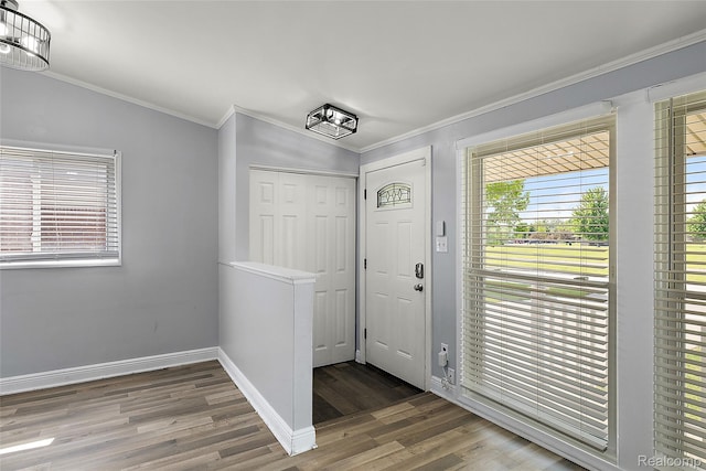 5115 Arden Ave, Warren, MI 48092 - foyer with crown molding, wood finished floors, and baseboards