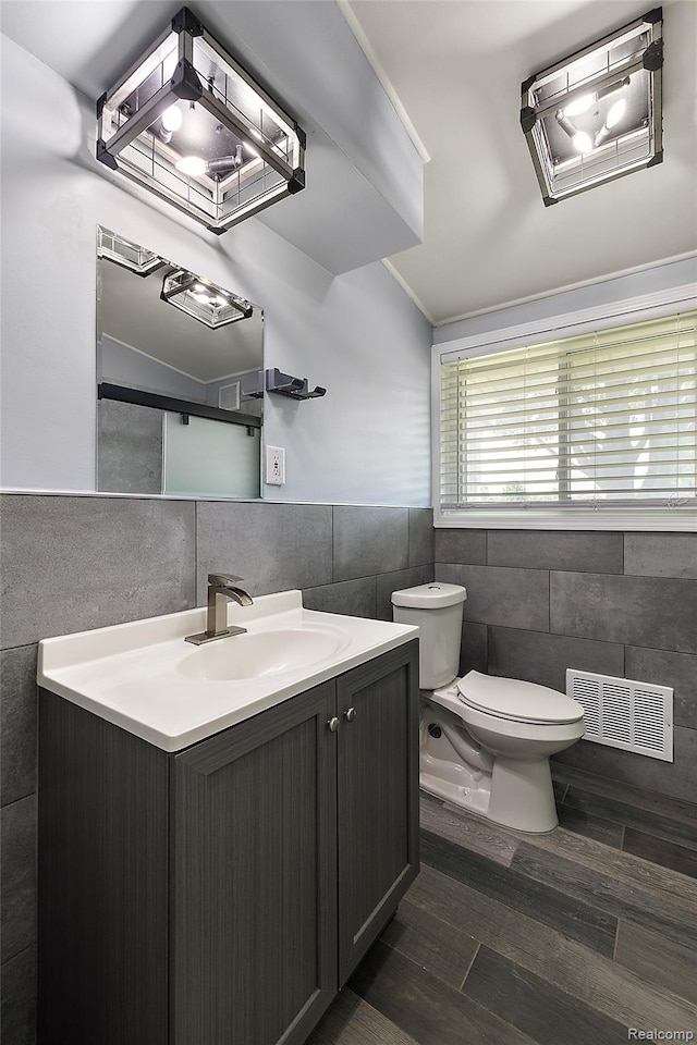 5115 Arden Ave, Warren, MI 48092 - bathroom with tile walls, vanity, and toilet