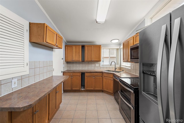 5115 Arden Ave, Warren, MI 48092 - kitchen featuring stainless steel appliances, a sink, brown cabinets, light tile patterned floors, and tasteful backsplash