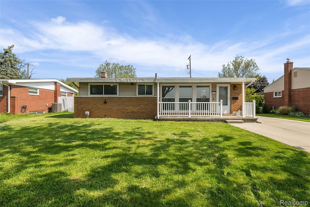 5115 Arden Ave, Warren, MI 48092 - ranch-style house with brick siding, a front lawn, and covered porch
