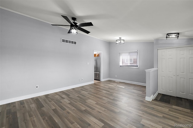 5115 Arden Ave, Warren, MI 48092 - unfurnished room featuring crown molding, baseboards, ceiling fan, and wood finished floors