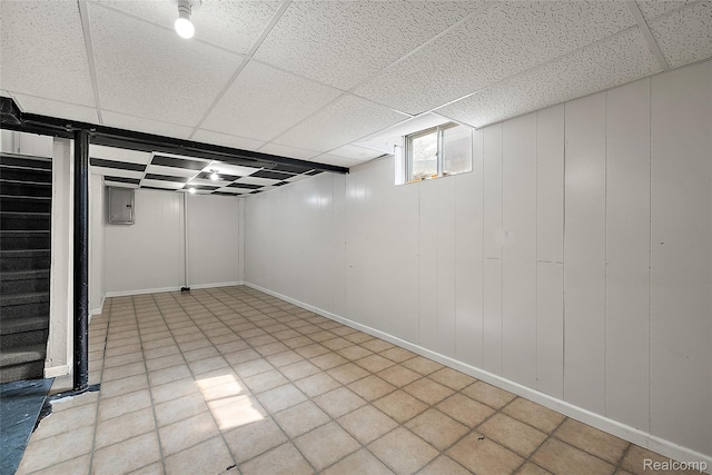 5115 Arden Ave, Warren, MI 48092 - basement with a drop ceiling, electric panel, stairs, and baseboards