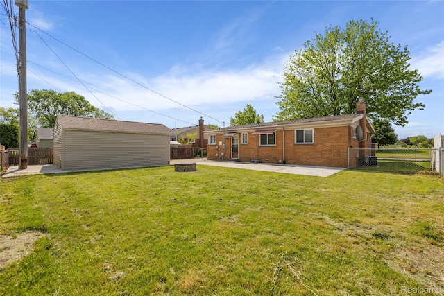 5115 Arden Ave, Warren, MI 48092 - view of yard featuring a patio, an outdoor fire pit, and an outdoor structure