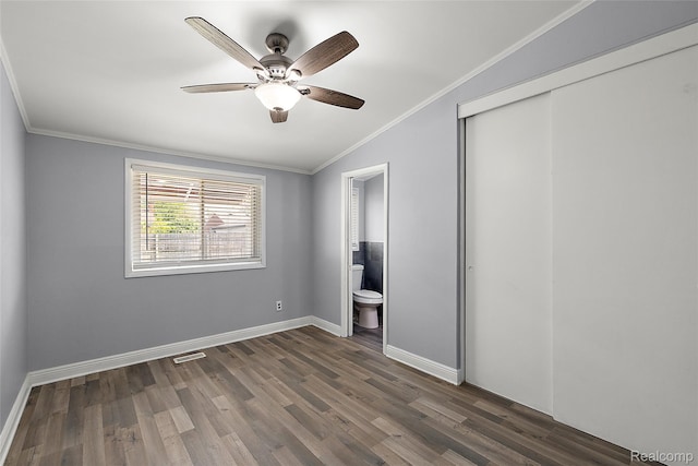 5115 Arden Ave, Warren, MI 48092 - unfurnished bedroom with crown molding, dark wood-style flooring, a closet, baseboards, and connected bathroom