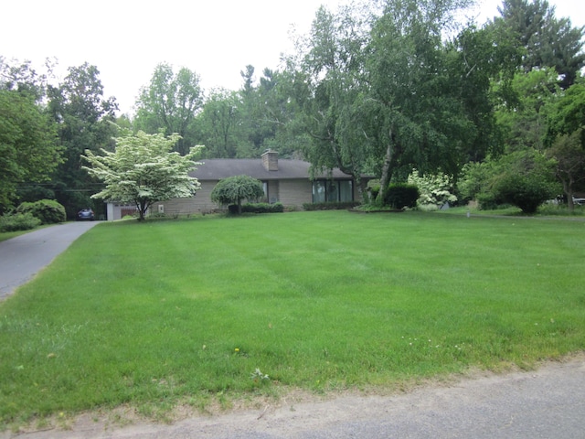 43859 60th Ave, Paw Paw, MI 49079 - ranch-style house featuring a front yard and a chimney