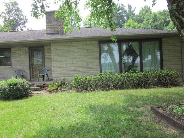 43859 60th Ave, Paw Paw, MI 49079 - back of house featuring a lawn and a chimney