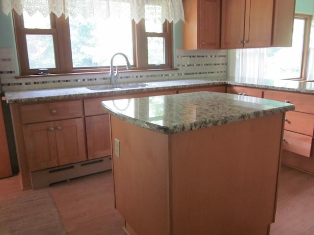 43859 60th Ave, Paw Paw, MI 49079 - kitchen with a sink, a baseboard radiator, healthy amount of natural light, and a kitchen island