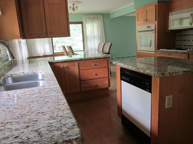 43859 60th Ave, Paw Paw, MI 49079 - kitchen featuring white appliances, a sink, dark wood-type flooring, baseboard heating, and light stone countertops