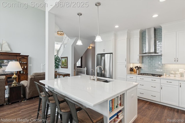 6130 Bullard Rd, Fenton, MI 48430 - kitchen with wall chimney exhaust hood, a sink, appliances with stainless steel finishes, dark wood-style flooring, and decorative backsplash