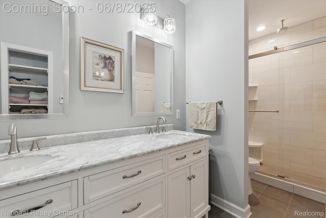 6130 Bullard Rd, Fenton, MI 48430 - full bath featuring double vanity, a shower stall, tile patterned floors, toilet, and a walk in closet