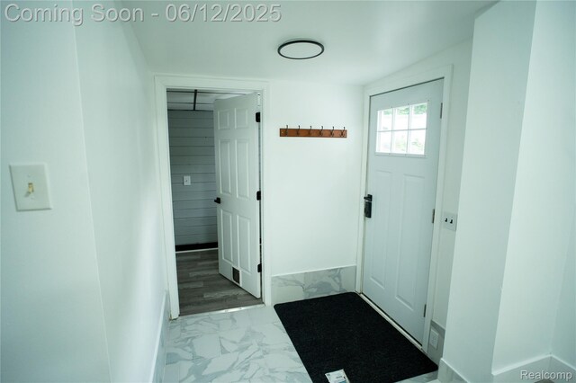 626 Wilwood Rd, Rochester Hills, MI 48309 - foyer entrance featuring marble look tile flooring and baseboards