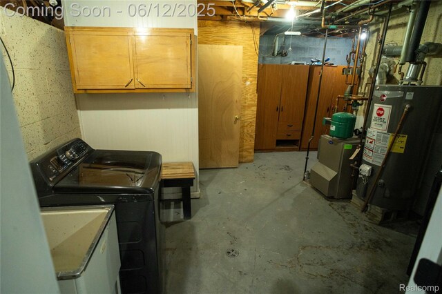 626 Wilwood Rd, Rochester Hills, MI 48309 - unfinished below grade area with water heater, separate washer and dryer, concrete block wall, and a heating unit