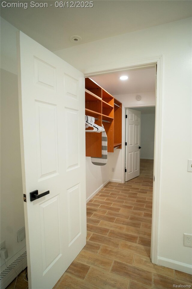 626 Wilwood Rd, Rochester Hills, MI 48309 - mudroom featuring baseboard heating, baseboards, light wood finished floors, and recessed lighting