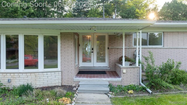 626 Wilwood Rd, Rochester Hills, MI 48309 - property entrance featuring french doors and brick siding