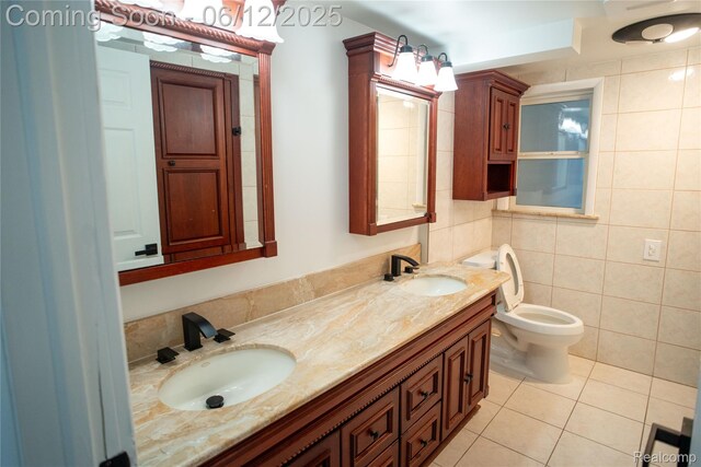 626 Wilwood Rd, Rochester Hills, MI 48309 - full bathroom featuring double vanity, tile patterned floors, tile walls, and toilet
