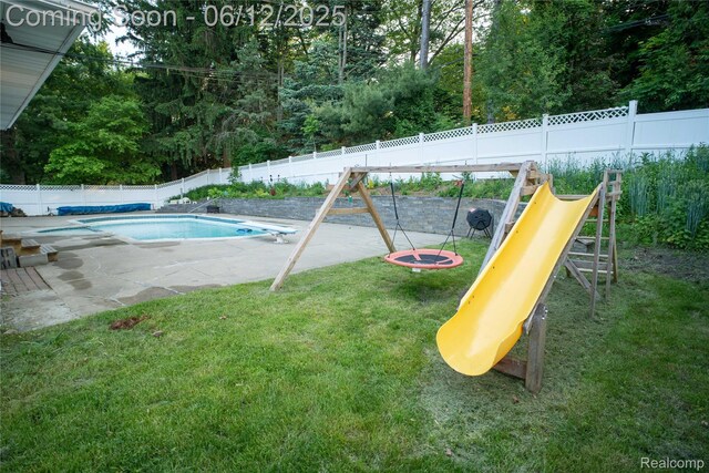 626 Wilwood Rd, Rochester Hills, MI 48309 - view of pool featuring a playground, a patio area, a diving board, and view of wooded area
