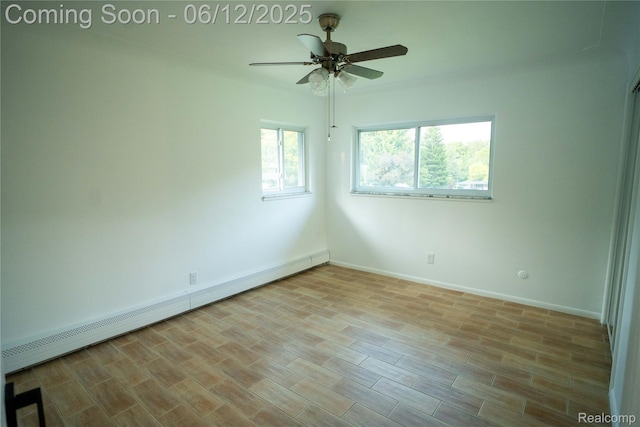 626 Wilwood Rd, Rochester Hills, MI 48309 - spare room featuring a baseboard radiator, ceiling fan, baseboards, and light wood finished floors