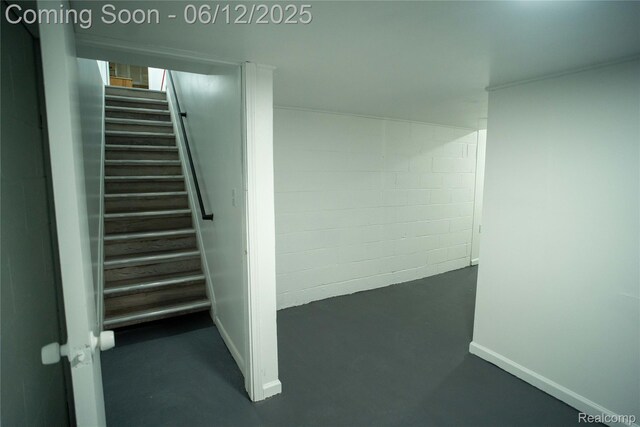 626 Wilwood Rd, Rochester Hills, MI 48309 - staircase featuring concrete block wall and concrete flooring