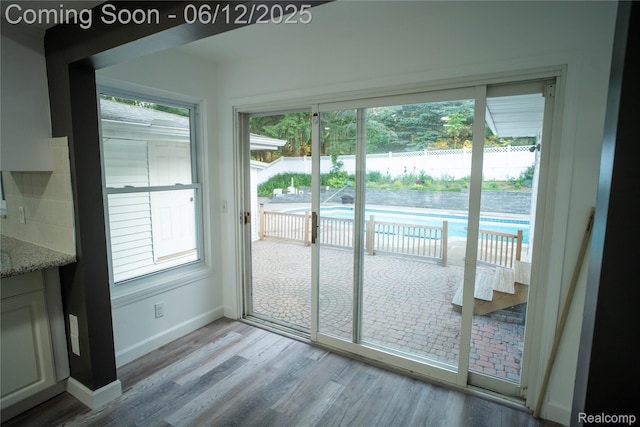 626 Wilwood Rd, Rochester Hills, MI 48309 - doorway with light wood-style flooring and baseboards
