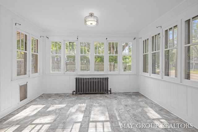 1951 Leonard St NW, Grand Rapids, MI 49504 - unfurnished sunroom featuring radiator and healthy amount of natural light