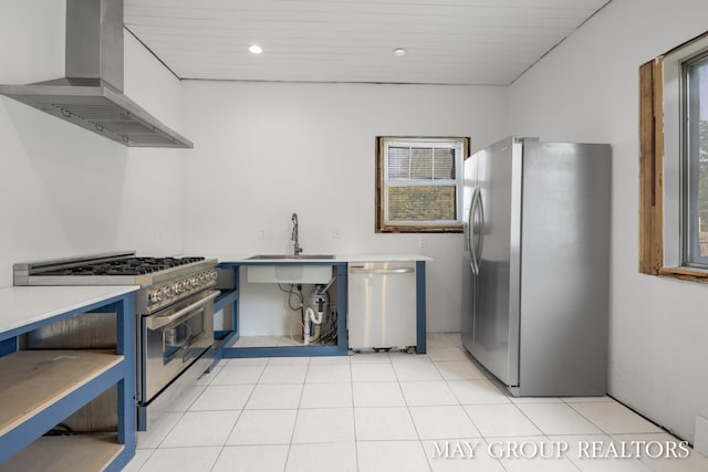 1951 Leonard St NW, Grand Rapids, MI 49504 - kitchen featuring stainless steel appliances, wall chimney range hood, a sink, light countertops, and recessed lighting