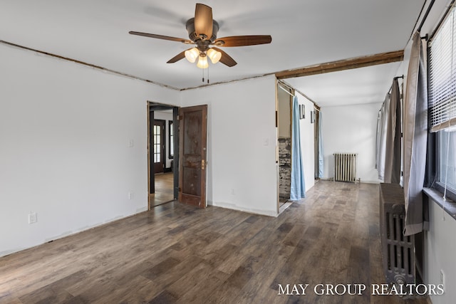 1951 Leonard St NW, Grand Rapids, MI 49504 - unfurnished room featuring radiator heating unit, a ceiling fan, wood finished floors, and plenty of natural light