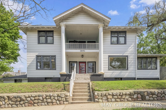 1951 Leonard St NW, Grand Rapids, MI 49504 - view of front of property with a balcony and a front lawn
