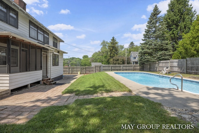 1951 Leonard St NW, Grand Rapids, MI 49504 - view of swimming pool with entry steps, a patio, and a sunroom