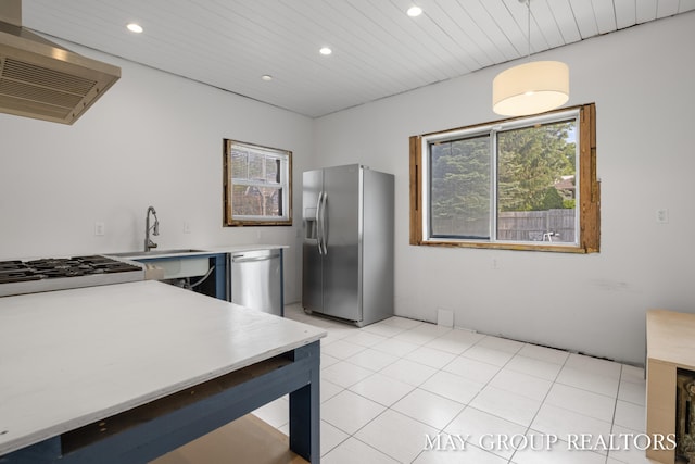 1951 Leonard St NW, Grand Rapids, MI 49504 - kitchen featuring appliances with stainless steel finishes, ventilation hood, recessed lighting, light countertops, and a sink