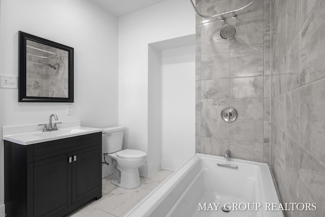 1951 Leonard St NW, Grand Rapids, MI 49504 - bathroom with marble look tile flooring, vanity, toilet, and  shower combination