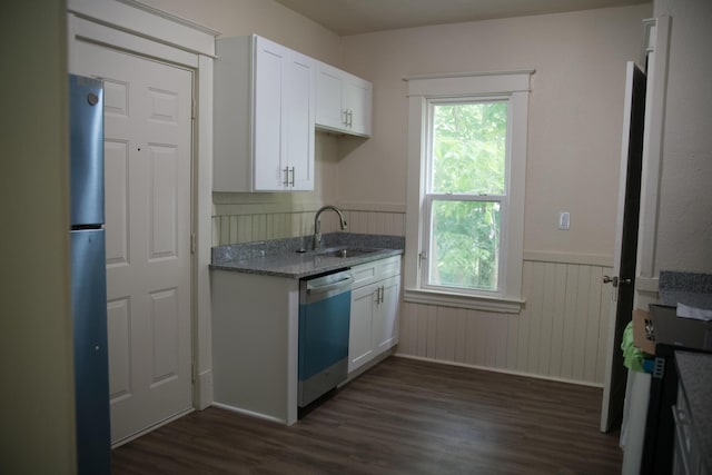 634 Ada St, Kalamazoo, MI 49007 - kitchen featuring dishwasher, a sink, plenty of natural light, dark wood-style flooring, and wainscoting