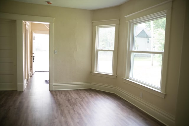 634 Ada St, Kalamazoo, MI 49007 - empty room with wood finished floors and baseboards