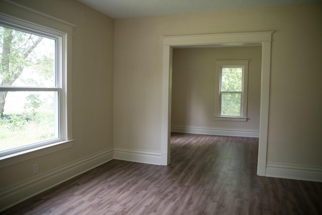 634 Ada St, Kalamazoo, MI 49007 - empty room with healthy amount of natural light and wood finished floors