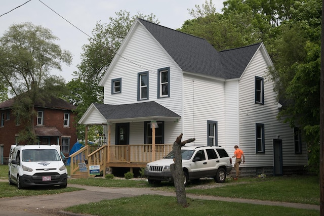 634 Ada St, Kalamazoo, MI 49007 - view of front of property with covered porch and a shingled roof
