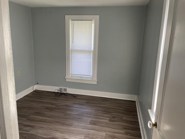 1803 Portage St, Kalamazoo, MI 49001 - empty room with wood finished floors and baseboards